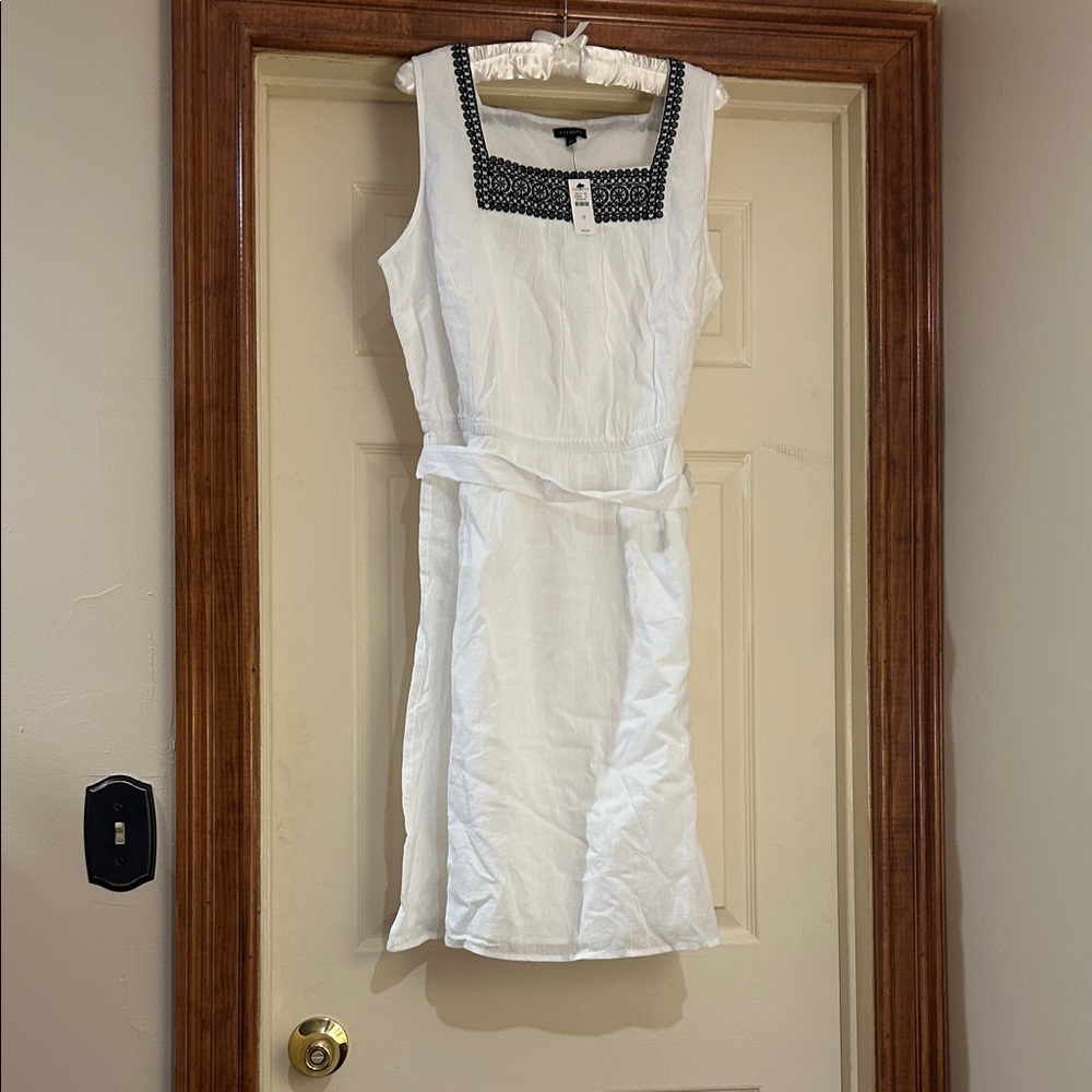 NWT White Sleeveless Dress with Black Embellished Neckline and light lining.
